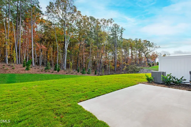 a house that has a big yard in front of it
