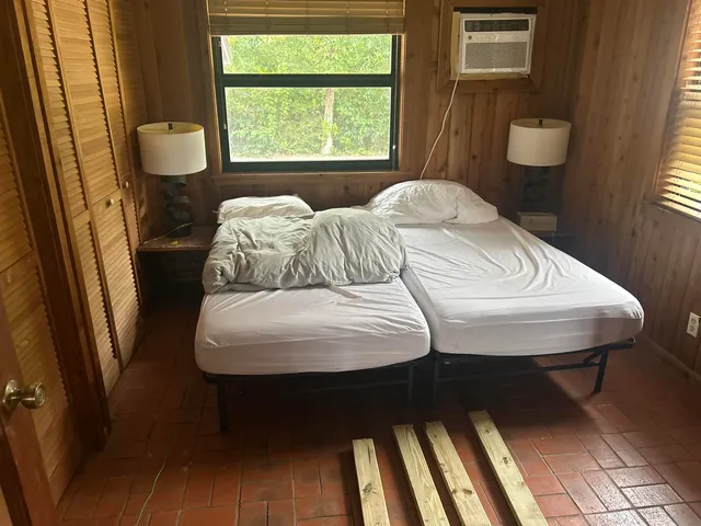 a bathroom with a sink mirror and toilet