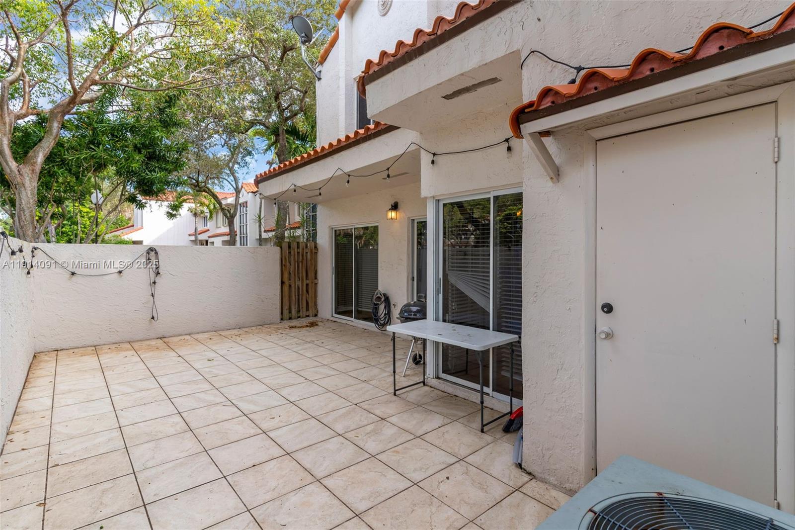 10930 Southwest 75th Street Miami, FL 33173 - Photo 26 of 34 a view of a house with backyard and a chair