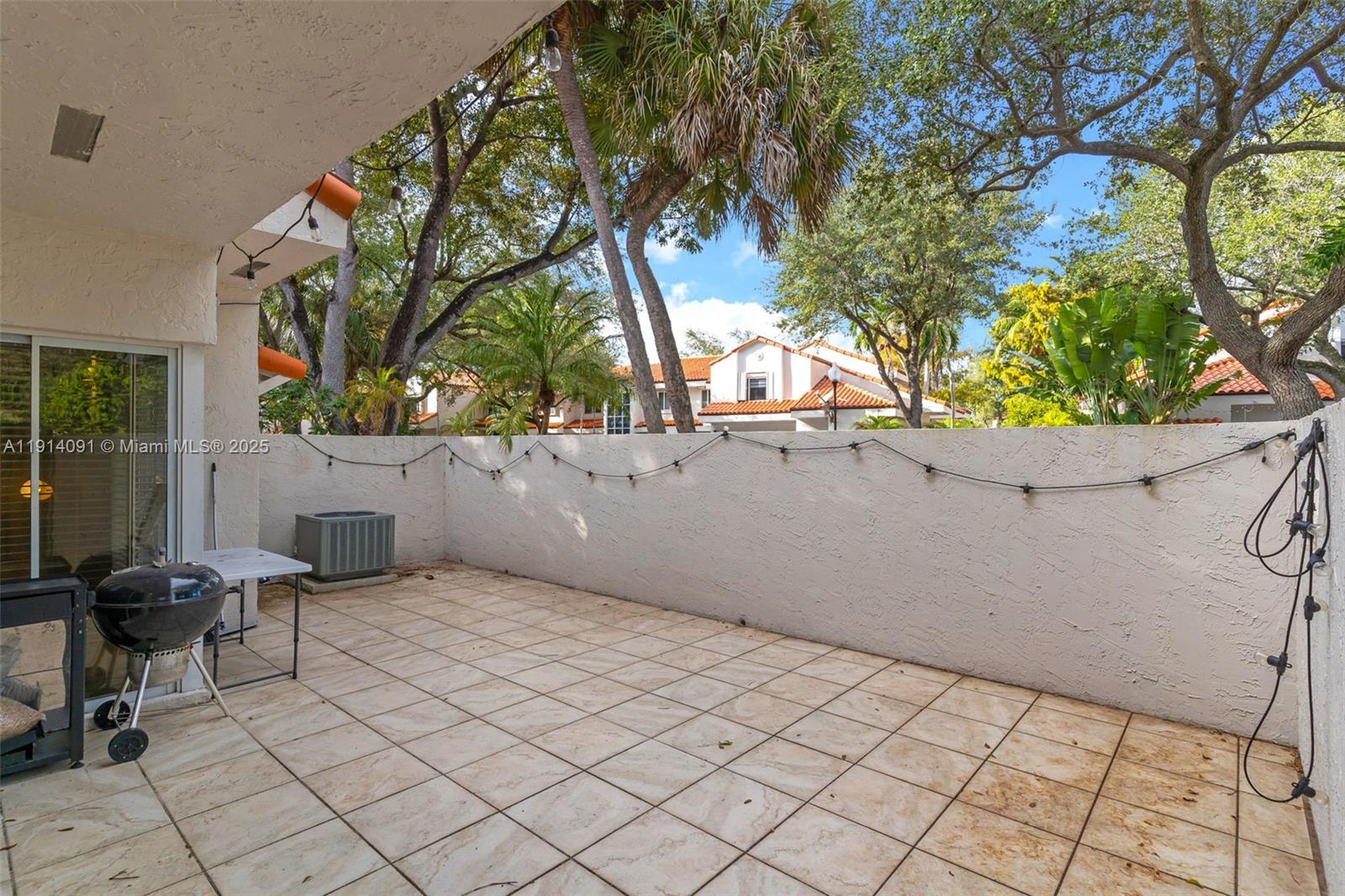 10930 Southwest 75th Street Miami, FL 33173 - Photo 28 of 34 a view of backyard and tree