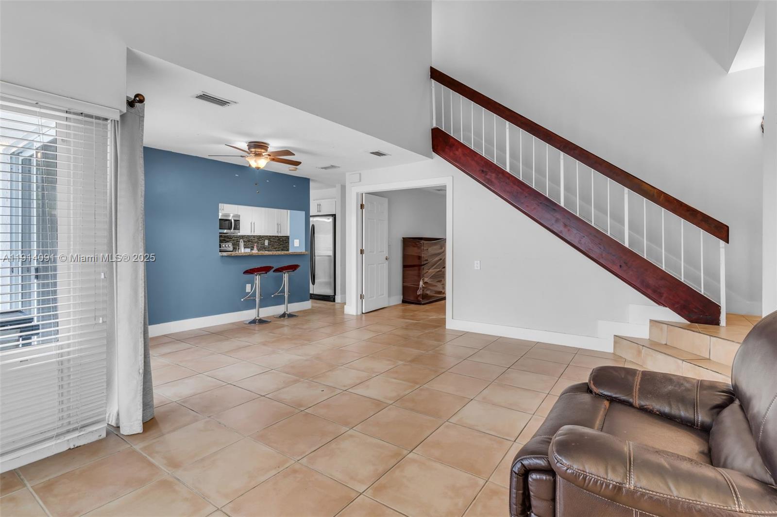 10930 Southwest 75th Street Miami, FL 33173 - Photo 6 of 34 a view of livingroom with furniture and stairs
