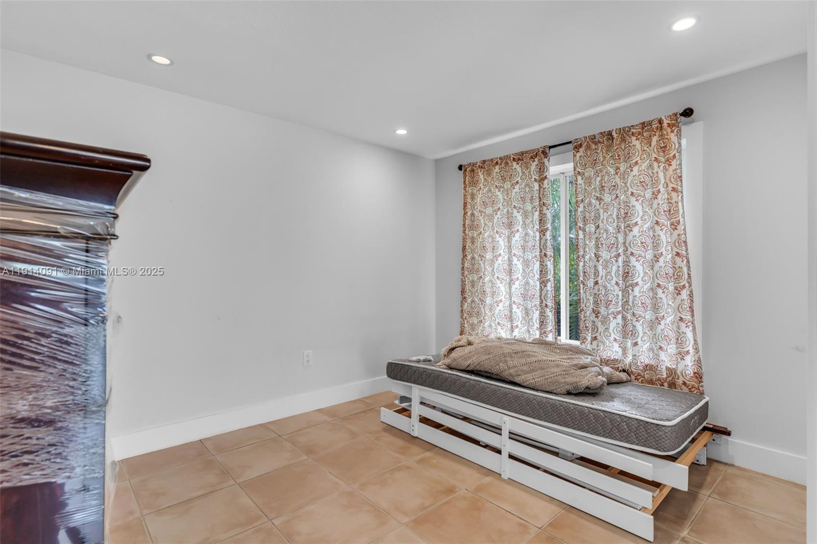 10930 Southwest 75th Street Miami, FL 33173 - Photo 10 of 34 a room with furniture and a window