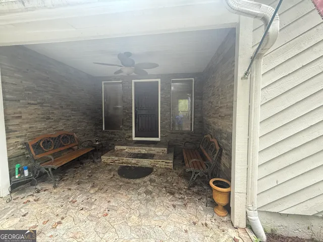 a view of a bathroom with a shower and a sink