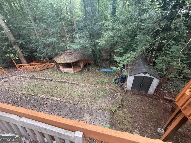 a view of a yard with an outdoor space