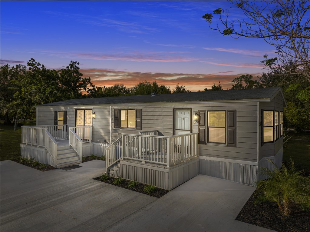 218 South Maple Street Fellsmere, FL 32948 - Photo 1 of 14 a view of a house with a patio