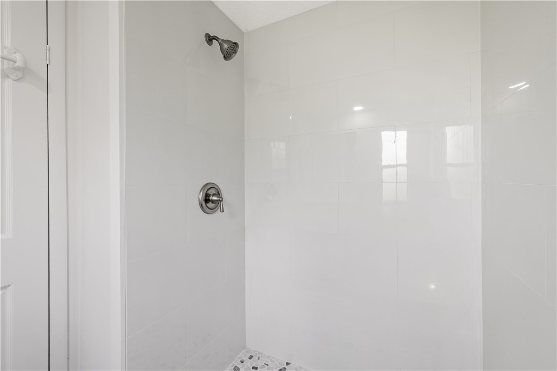 218 South Maple Street Fellsmere, FL 32948 - Photo 11 of 14 a bathroom with a shower