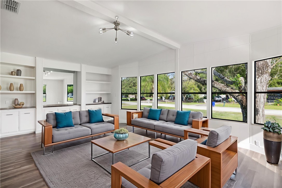 218 South Maple Street Fellsmere, FL 32948 - Photo 6 of 14 a living room with furniture and a large window
