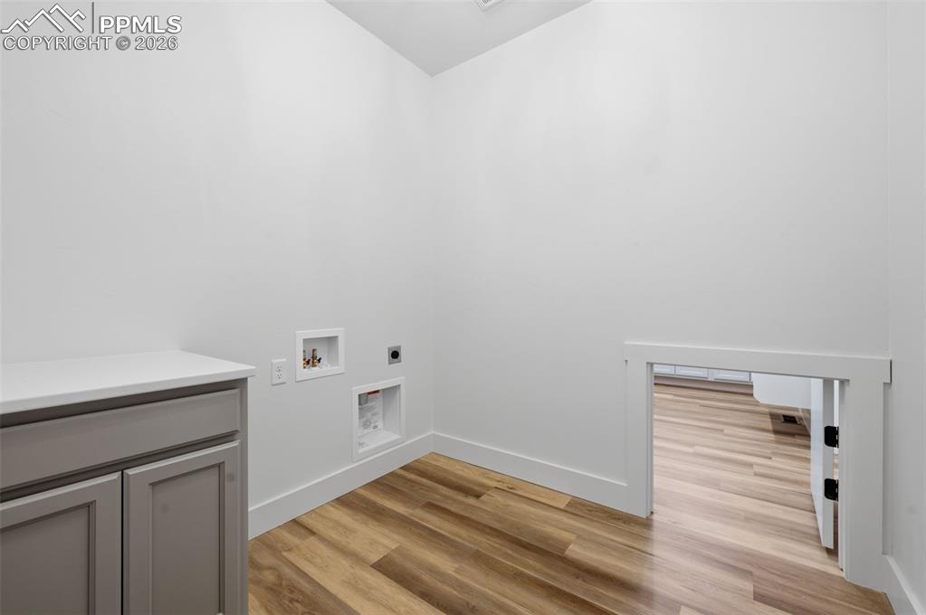 11293 Est Rdg Drive Peyton, CO 80831 - Photo 13 of 50 a view of storage and utility room with wooden floor