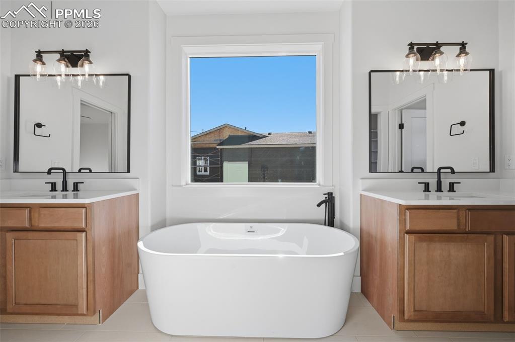 11293 Est Rdg Drive Peyton, CO 80831 - Photo 18 of 50 a white bath tub sitting next to a bathroom sink