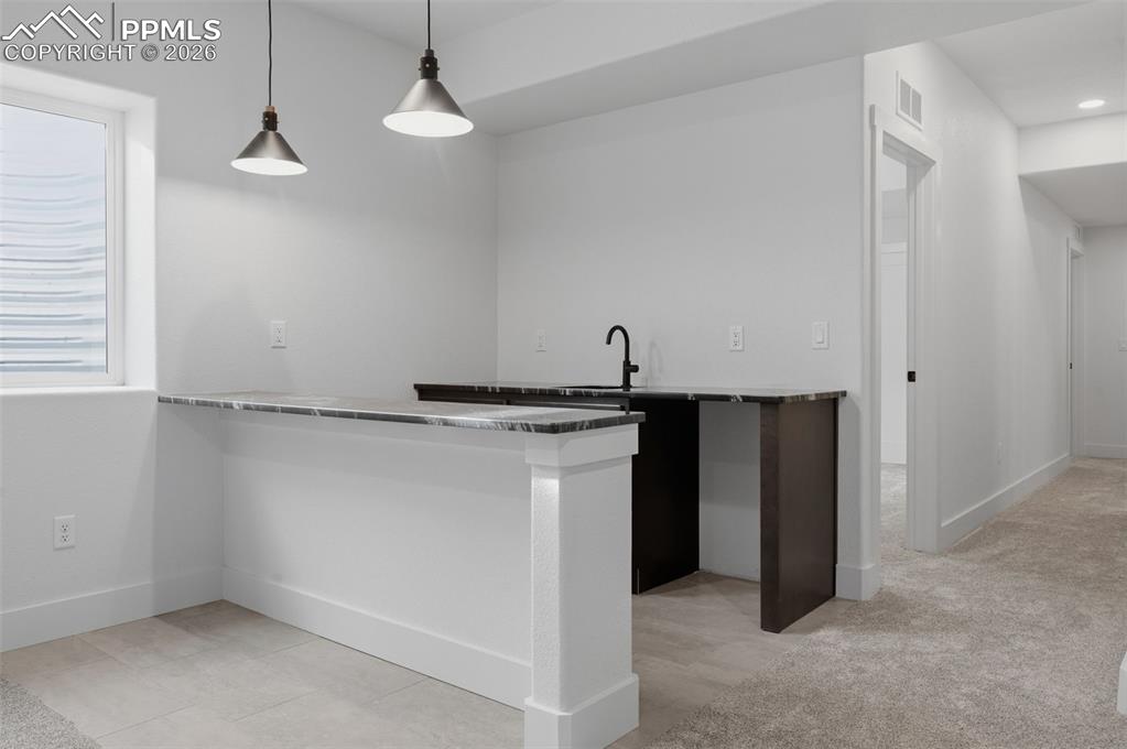 11293 Est Rdg Drive Peyton, CO 80831 - Photo 22 of 50 a kitchen view with a stove and a refrigerator