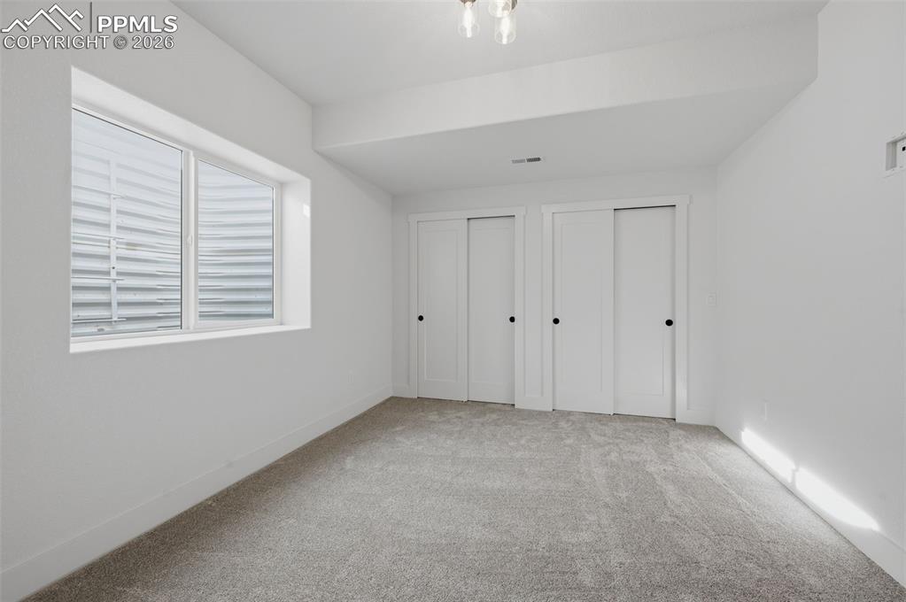 11293 Est Rdg Drive Peyton, CO 80831 - Photo 29 of 50 a view of an empty room with a window