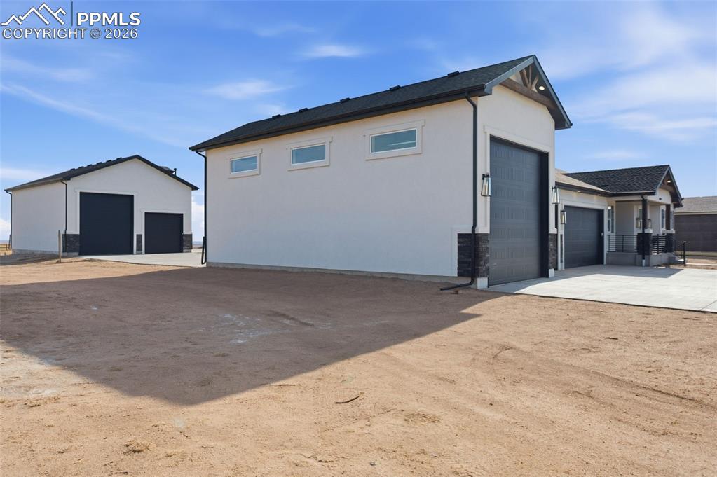 11293 Est Rdg Drive Peyton, CO 80831 - Photo 3 of 50 a view of a house with a snow in the background