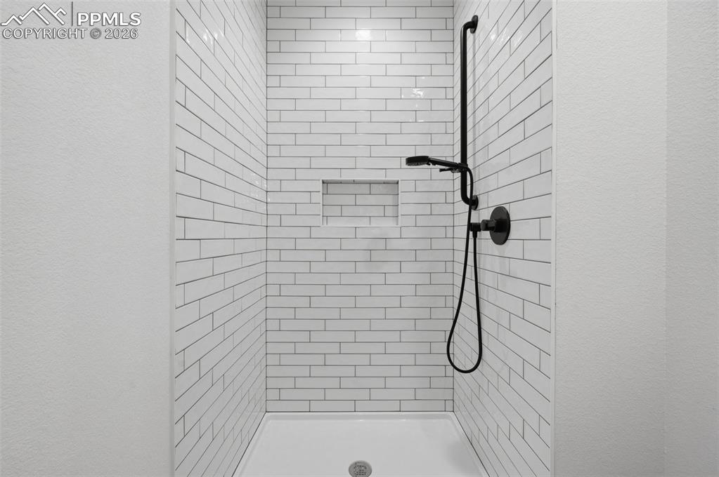 11293 Est Rdg Drive Peyton, CO 80831 - Photo 32 of 50 a bathroom with a shower