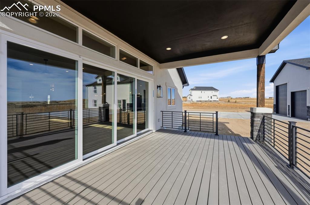 11293 Est Rdg Drive Peyton, CO 80831 - Photo 40 of 50 a view of a balcony with wooden floor