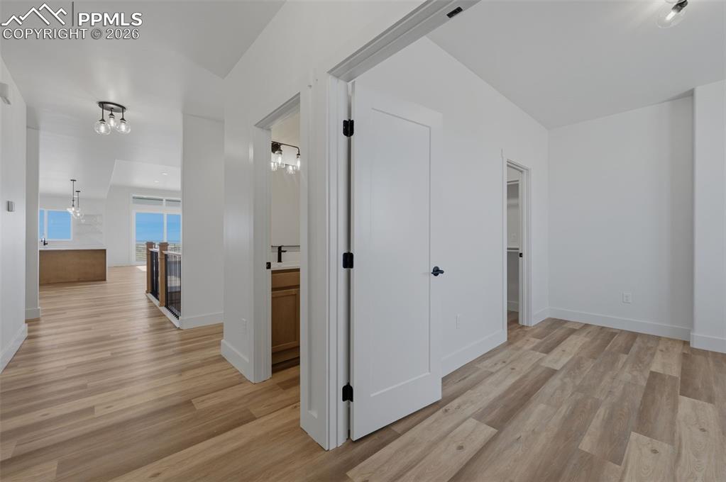 11293 Est Rdg Drive Peyton, CO 80831 - Photo 4 of 50 a view of a hallway with wooden floor and staircase