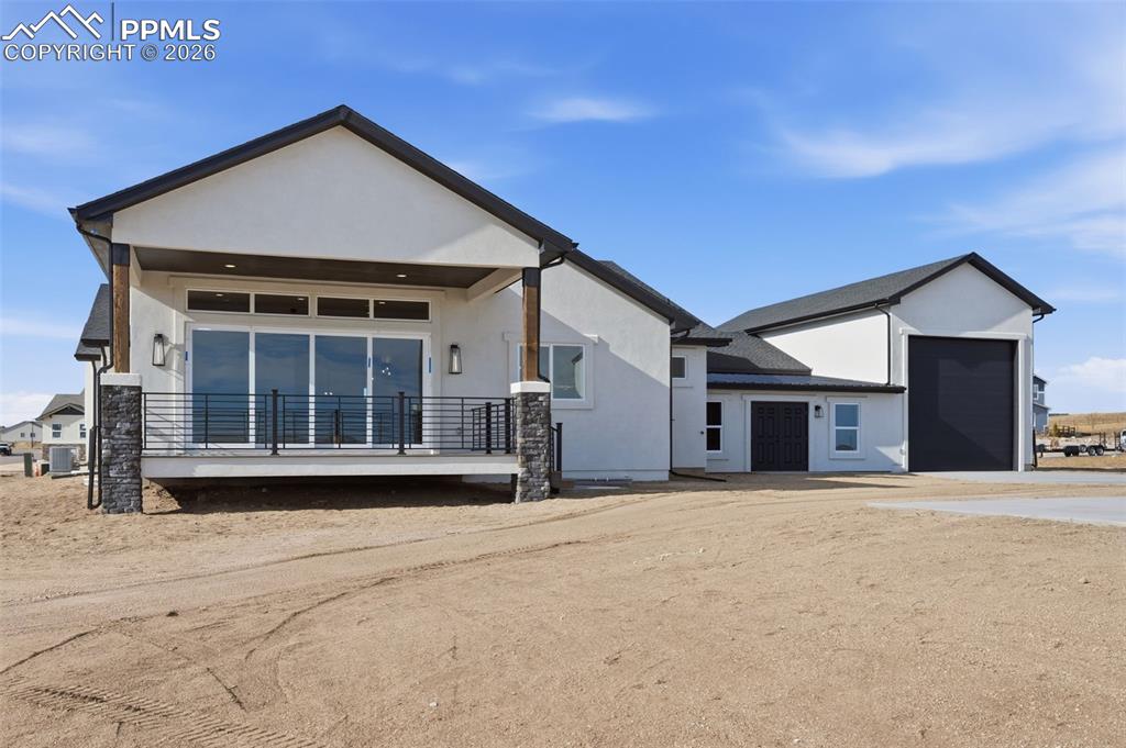 11293 Est Rdg Drive Peyton, CO 80831 - Photo 42 of 50 a front view of a house with a yard