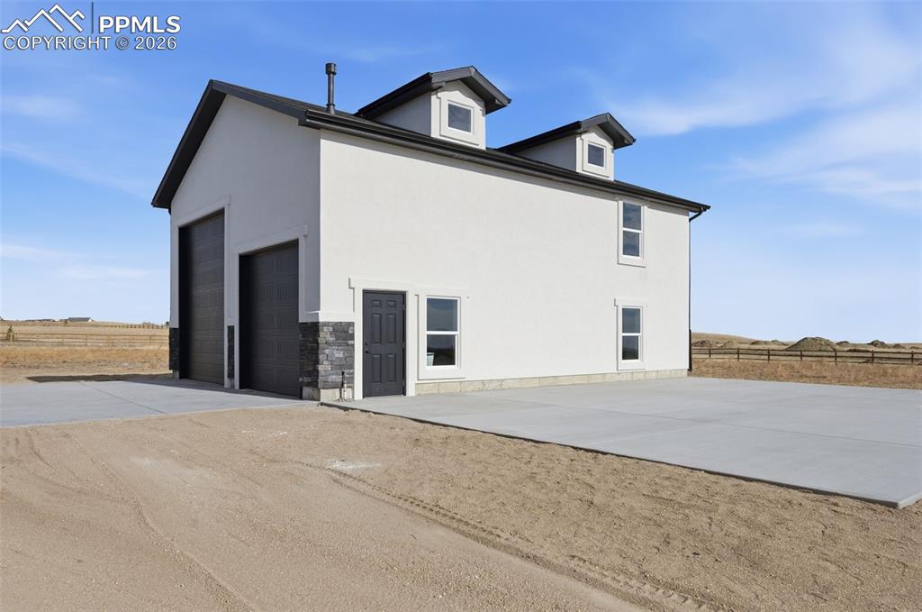 11293 Est Rdg Drive Peyton, CO 80831 - Photo 45 of 50 a front view of a house with a yard