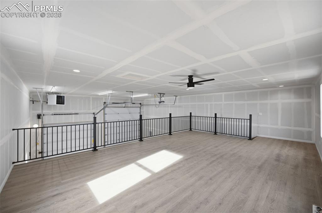 11293 Est Rdg Drive Peyton, CO 80831 - Photo 50 of 50 an empty room with wooden floor and windows