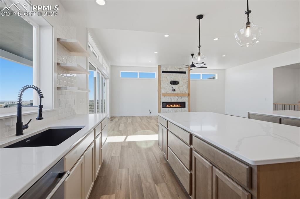 11293 Est Rdg Drive Peyton, CO 80831 - Photo 6 of 50 a kitchen with a sink and a stove top oven