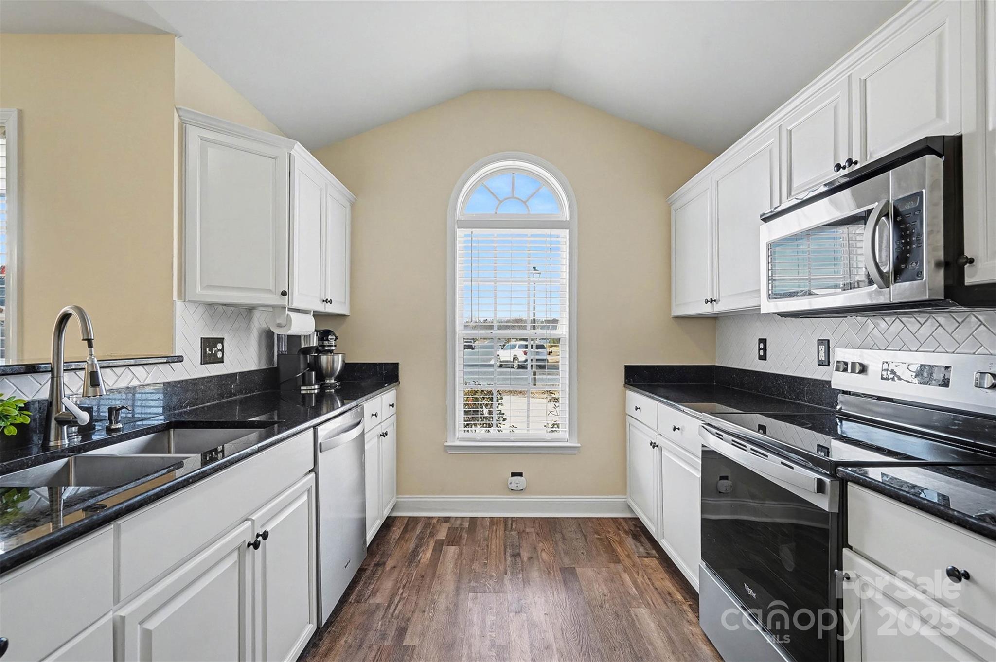413 Dexter Place Monroe, NC 28110 - Photo 13 of 32 a kitchen with stainless steel appliances granite countertop a sink stove and cabinets
