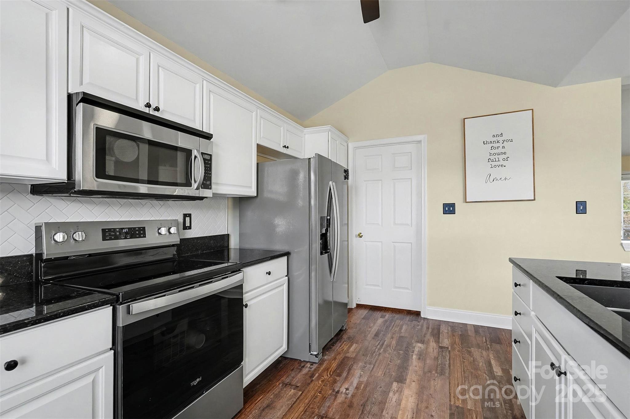 413 Dexter Place Monroe, NC 28110 - Photo 16 of 32 a kitchen with stainless steel appliances a stove microwave and sink