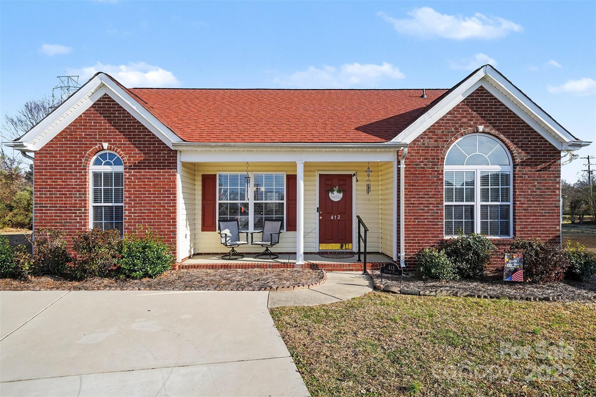 413 Dexter Place Monroe, NC 28110 - Photo 2 of 32 a front view of a house with garden