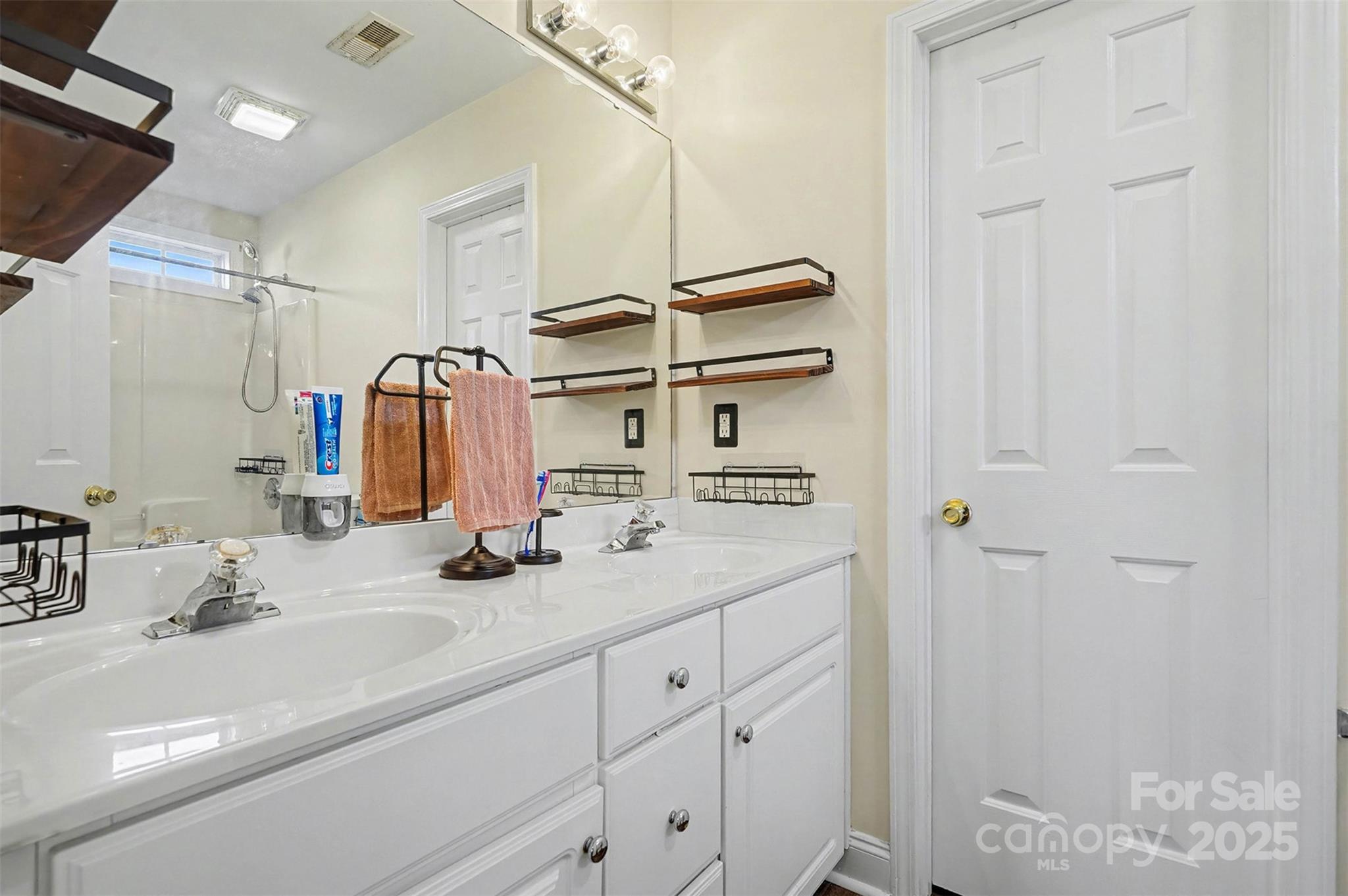 413 Dexter Place Monroe, NC 28110 - Photo 22 of 32 a bathroom with a sink and a mirror