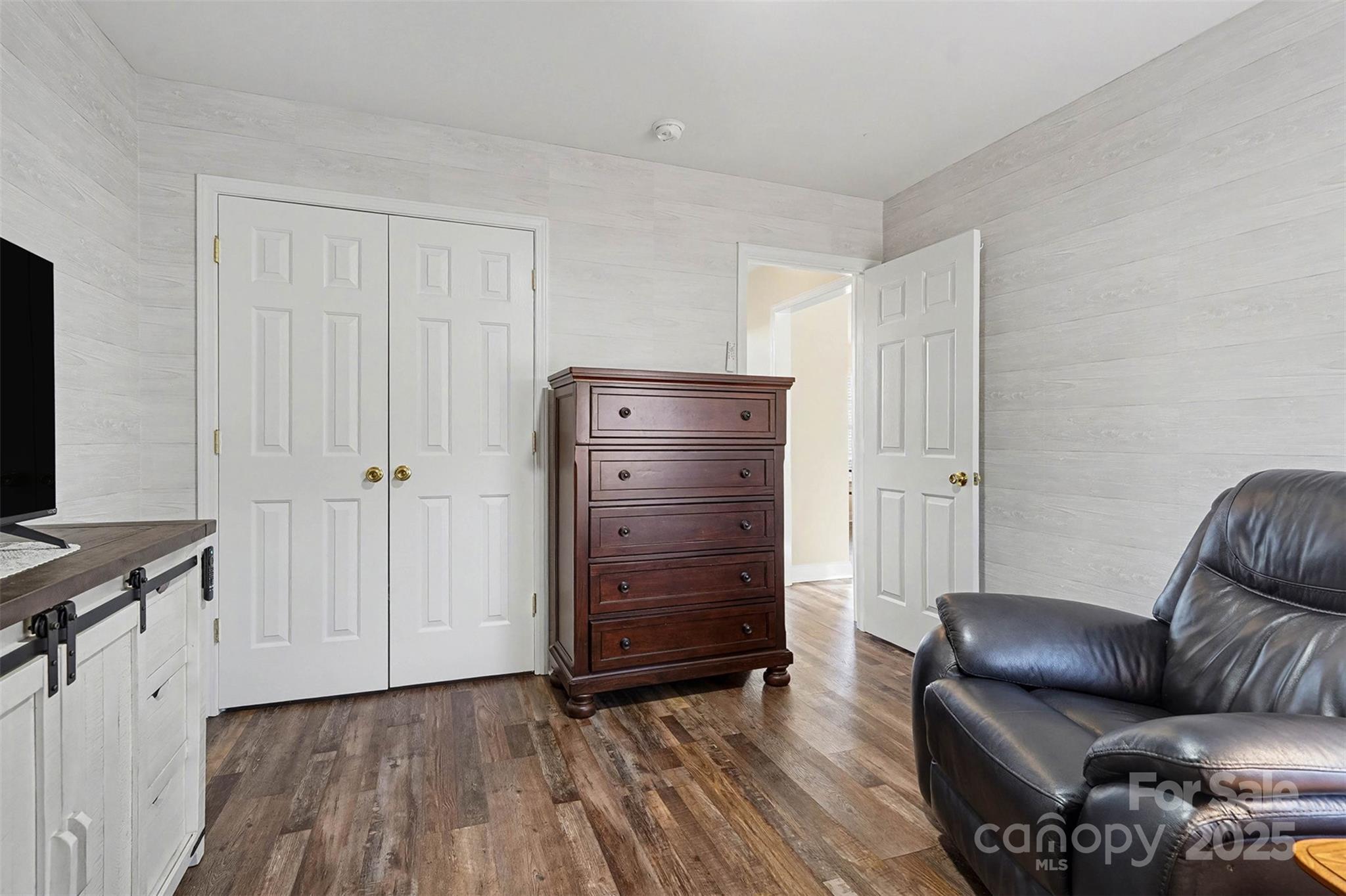 413 Dexter Place Monroe, NC 28110 - Photo 25 of 32 a view of room with furniture and wooden floor