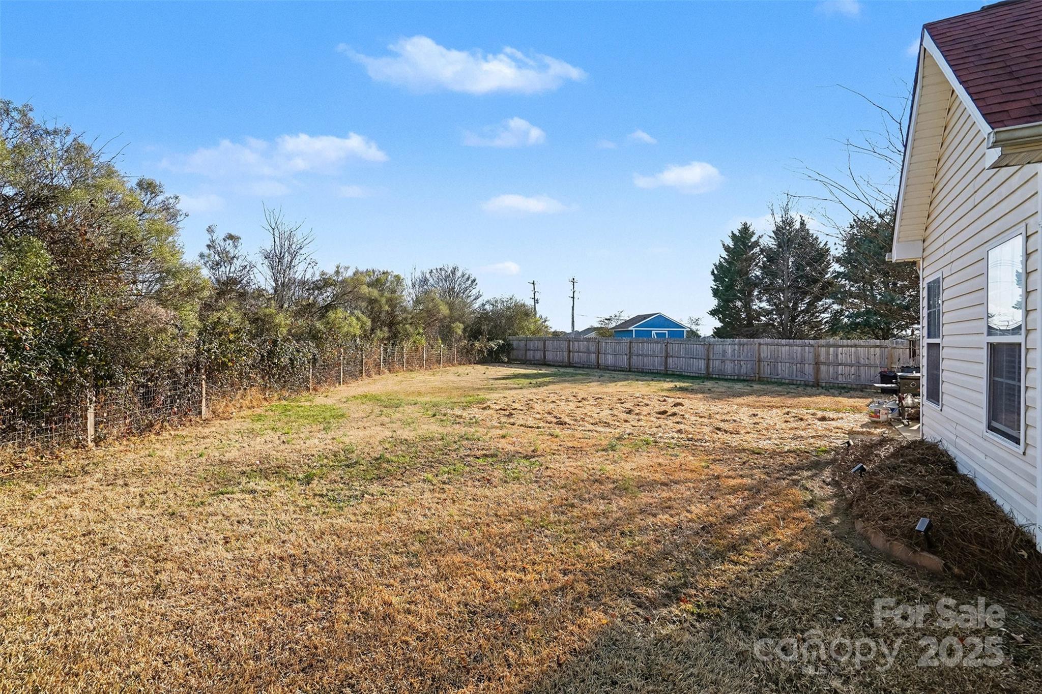 413 Dexter Place Monroe, NC 28110 - Photo 29 of 32 a view of yard with swimming pool and trees in the background