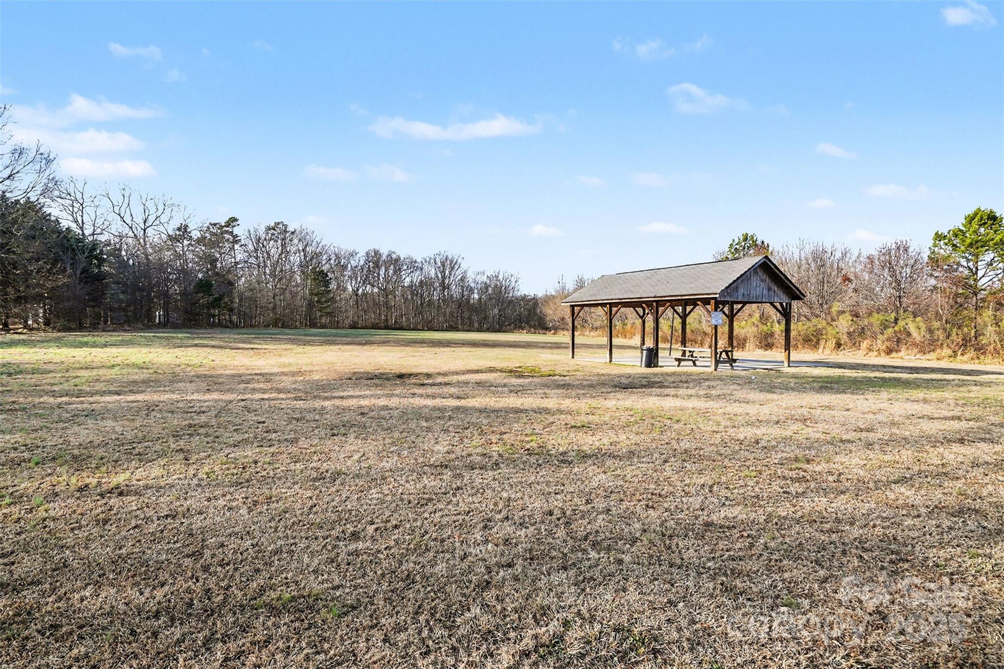 413 Dexter Place Monroe, NC 28110 - Photo 30 of 32 a view of an house with backyard and a ocean