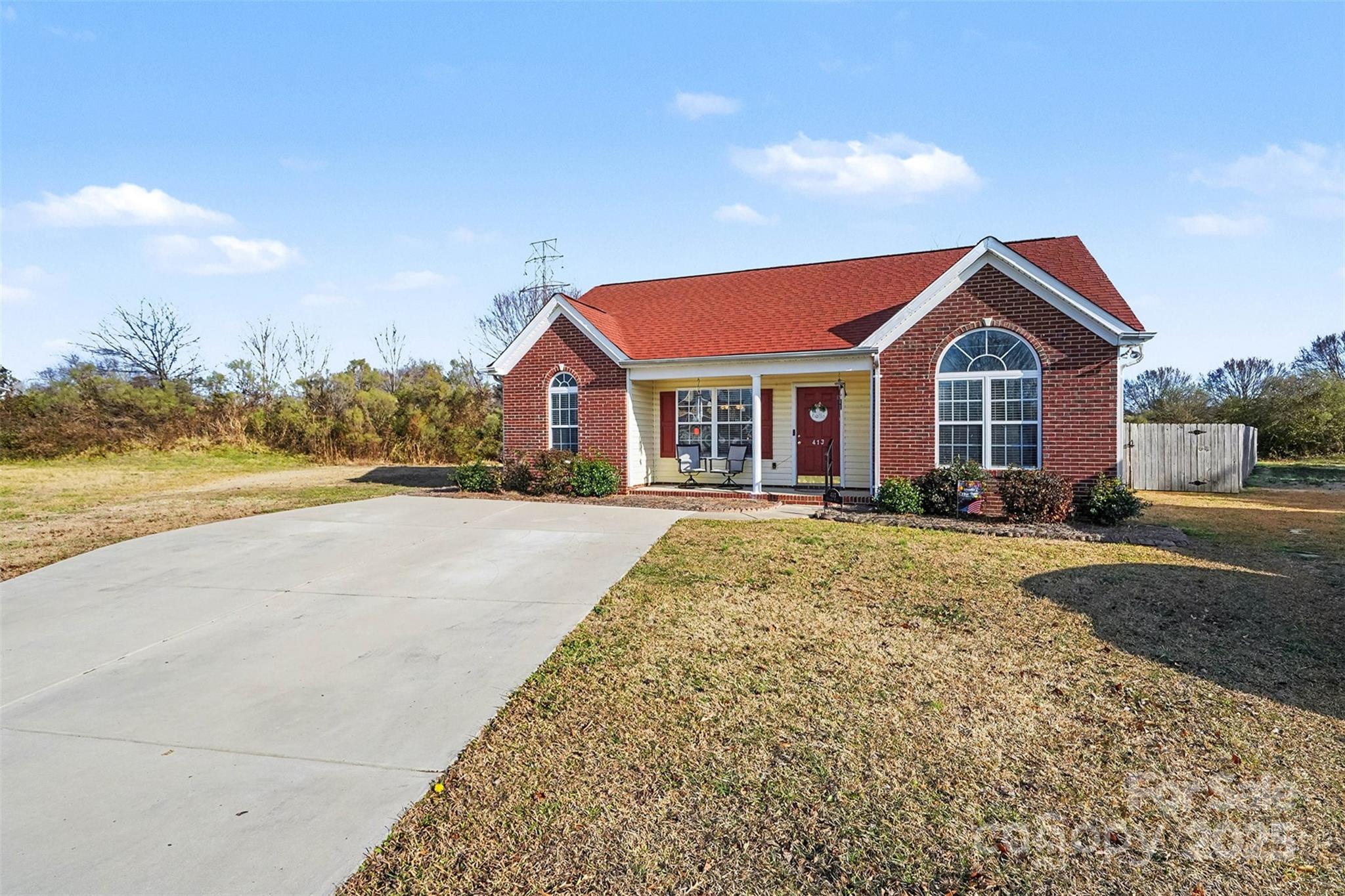 413 Dexter Place Monroe, NC 28110 - Photo 3 of 32 a front view of a house with a yard and ocean view