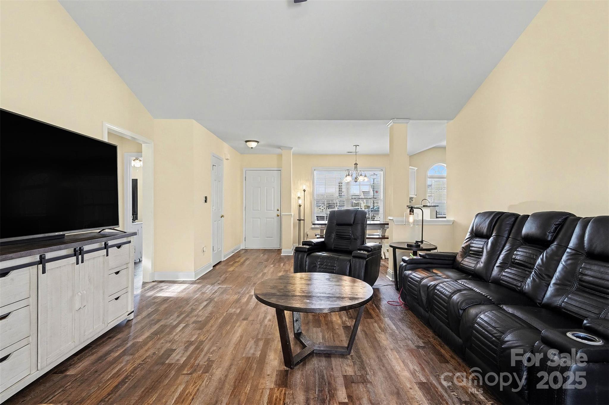 413 Dexter Place Monroe, NC 28110 - Photo 7 of 32 a living room with furniture and a flat screen tv