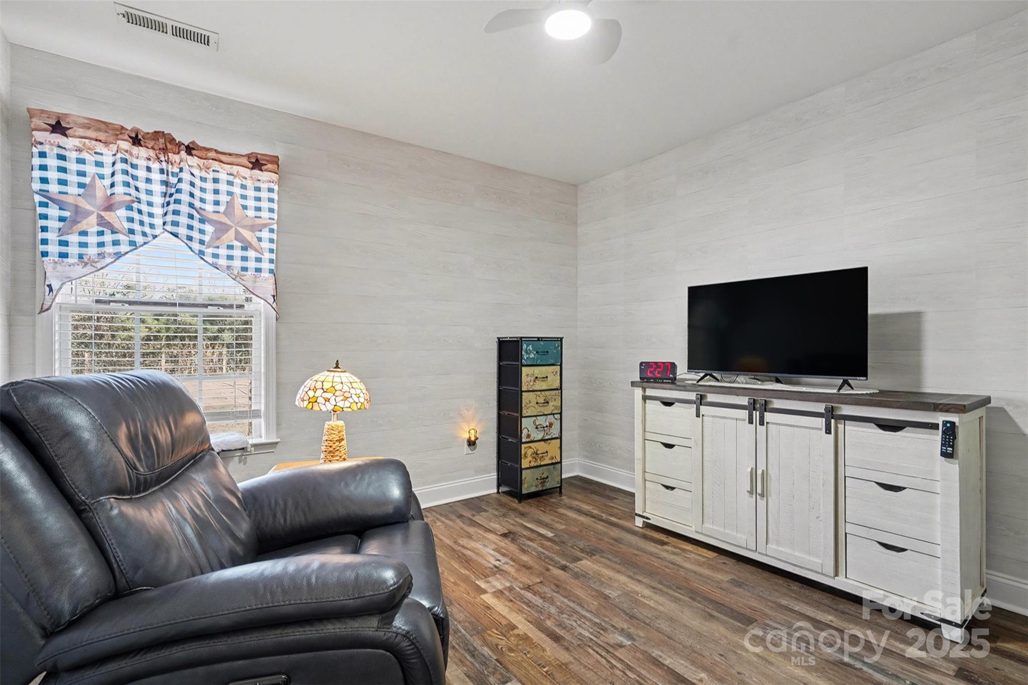 413 Dexter Place Monroe, NC 28110 - Photo 9 of 32 a living room with furniture and a flat screen tv