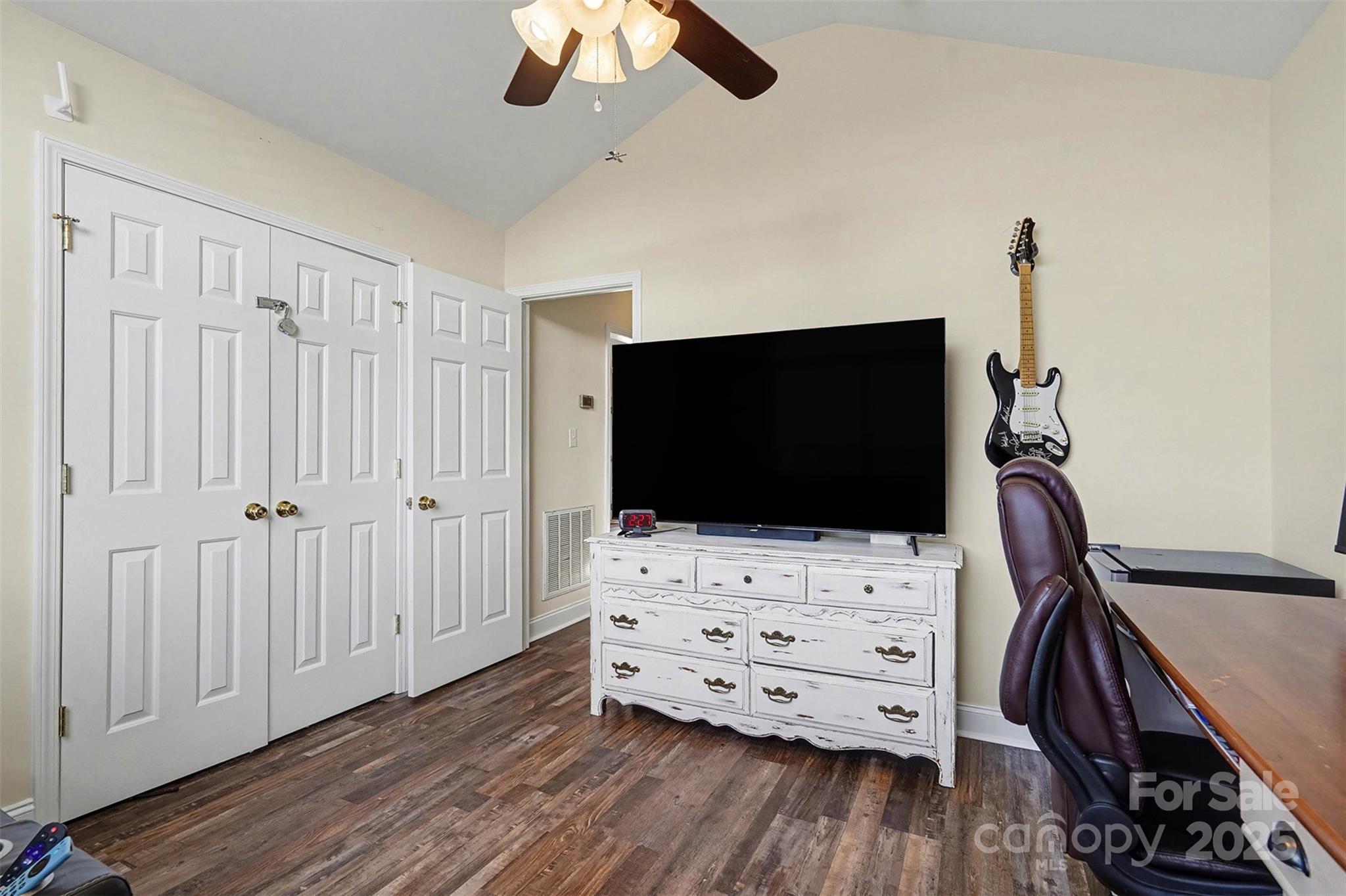 413 Dexter Place Monroe, NC 28110 - Photo 10 of 32 a room with wooden floor and flat screen tv