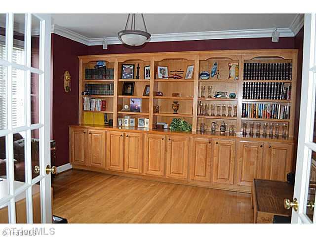 7083 Lanier Road Summerfield, NC 27358 - Photo 10 of 25 Studio/Study/Office. Main level office/study with wonderful built-ins and hardwood floors!