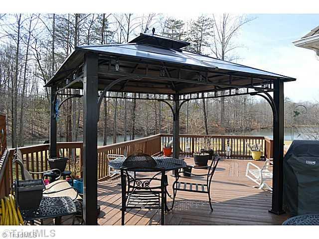 7083 Lanier Road Summerfield, NC 27358 - Photo 14 of 25 Exterior Back. Large deck for relaxing and entertaining!