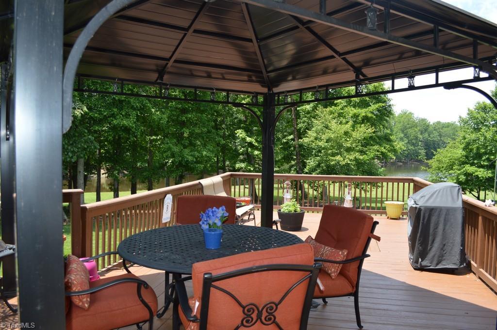 7083 Lanier Road Summerfield, NC 27358 - Photo 16 of 25 Enjoy the beautiful outdoor living space from your amazing deck!