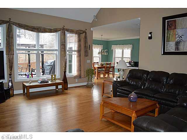 7083 Lanier Road Summerfield, NC 27358 - Photo 2 of 25 Den/Family/Great Room. Great flow to the home with plenty of light for warm feeling.