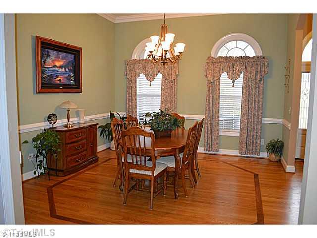 7083 Lanier Road Summerfield, NC 27358 - Photo 3 of 25 Dining Room. Perfect for entertaining! Notice the beautiful wood inlay!