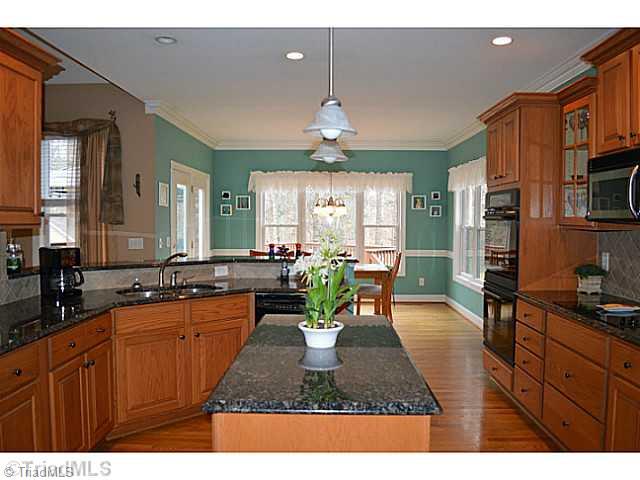 7083 Lanier Road Summerfield, NC 27358 - Photo 5 of 25 Kitchen. View from kitchen area with great light and ample space!
