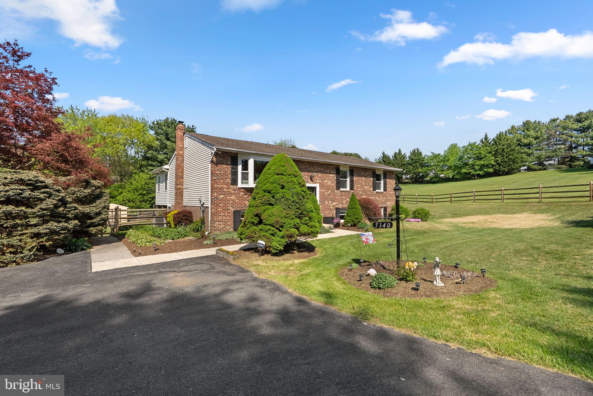 5140 Perry Road Mount Airy, MD 21771 - Photo 3 of 55 Charming home with lush greenery.