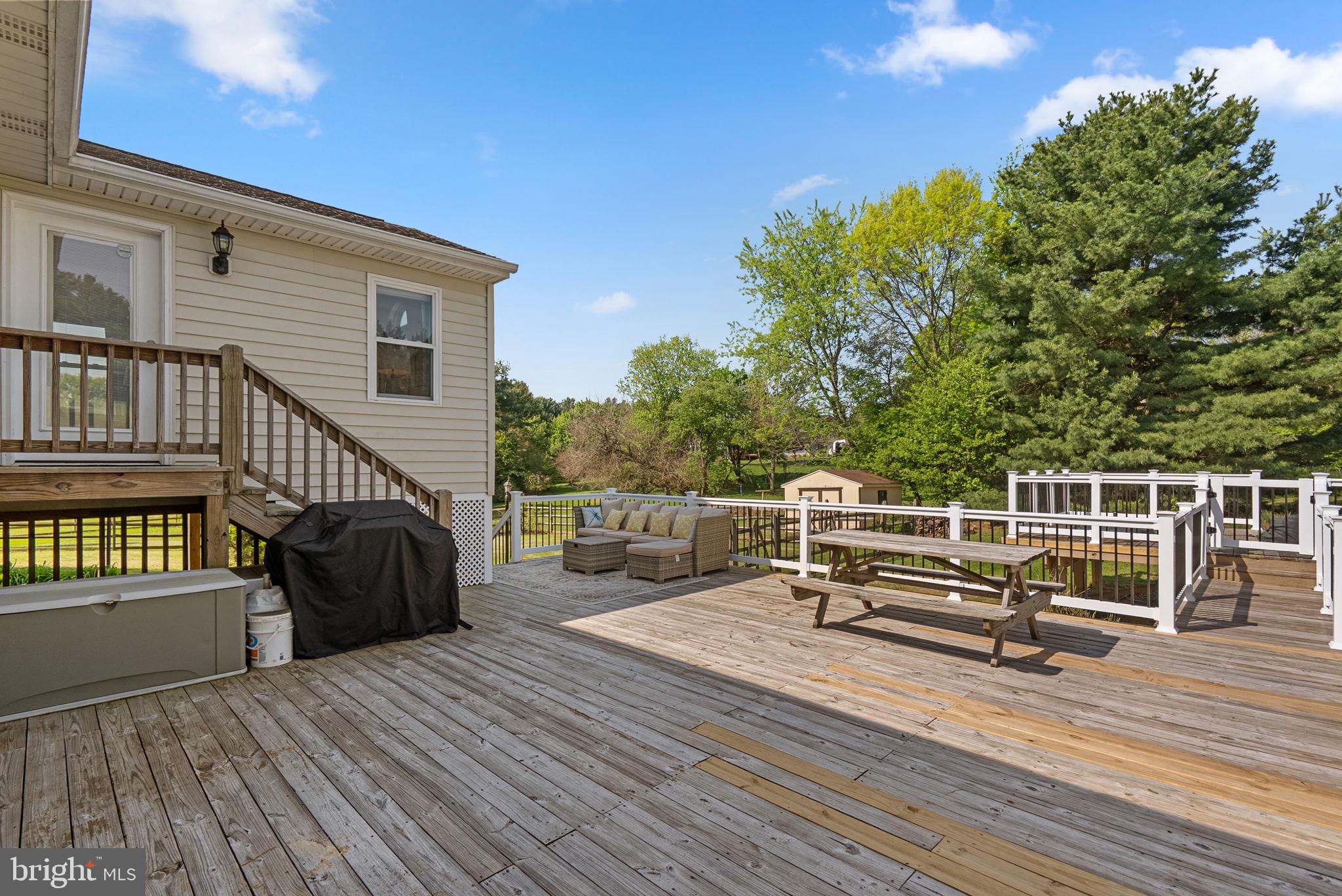5140 Perry Road Mount Airy, MD 21771 - Photo 38 of 55 Spacious deck with serene greenery.