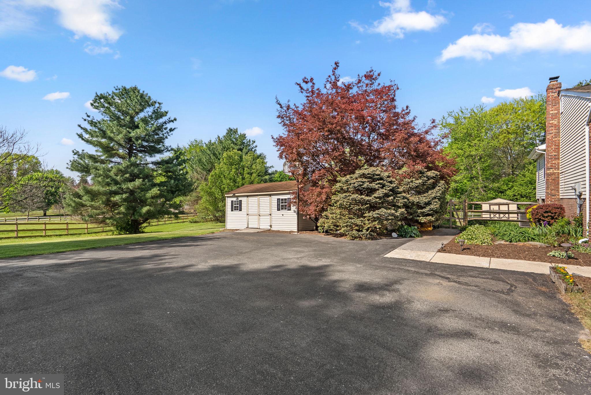 5140 Perry Road Mount Airy, MD 21771 - Photo 44 of 55 Charming outdoor space with lush greenery.