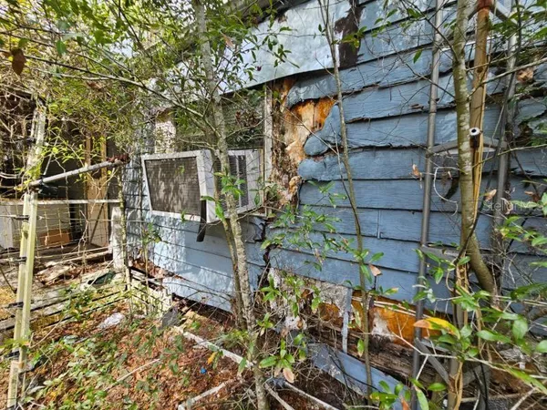 a view of a house with a tree