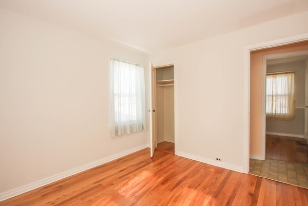 34 Surrey Road Springfield, MA 01118 - Photo 9 of 26 an empty room with wooden floor and windows