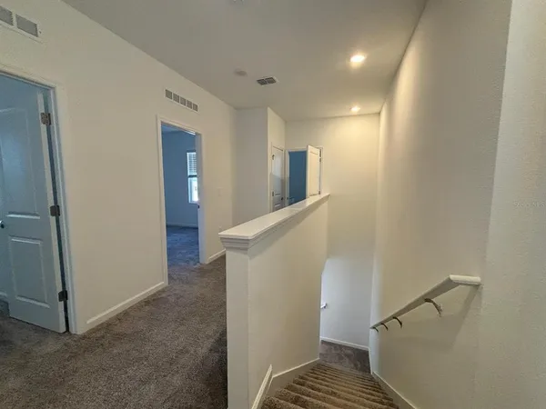 a bathroom with a tub sink and vanity