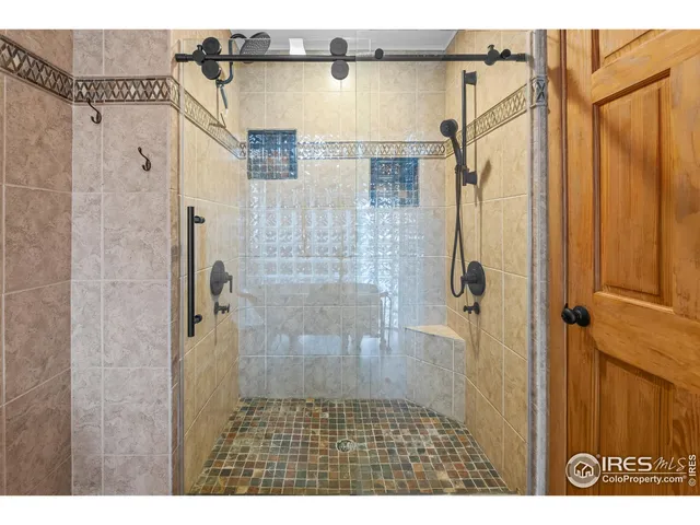 a bathroom with a bathtub and shower