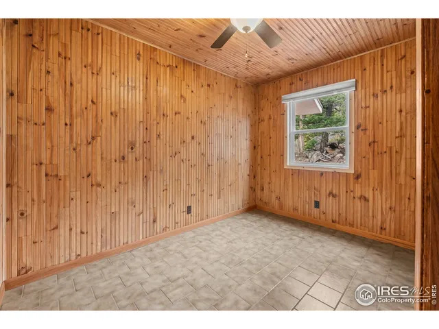 a bathroom with a tub a sink and mirror