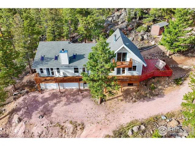 a view of a cars park in front of building