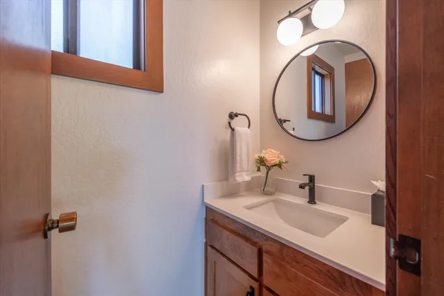 a bathroom with a sink and a mirror